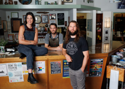 Bob's Three Adult Children Stand at the Waxman Showroom Counter.